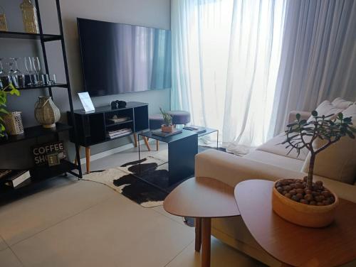 a living room with a couch and a table at LK Funcionários 6 in Belo Horizonte
