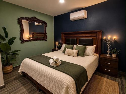 a bedroom with a bed with a teddy bear on it at La Casita Inn Bustamante in Bustamante
