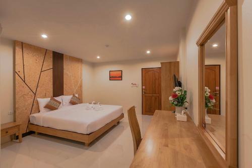 מיטה או מיטות בחדר ב-JS Residence Krabi