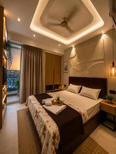 a bedroom with a large bed with a tray on it at SriVa Nest in Ghaziabad