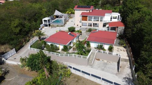 an aerial view of a house with red roofs at Bungalow Brise Marine - Plaisir d Évasion in Deshaies