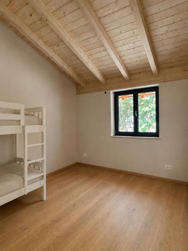 a room with a bunk bed and a window at Ferienhof Haug in Bad Hindelang