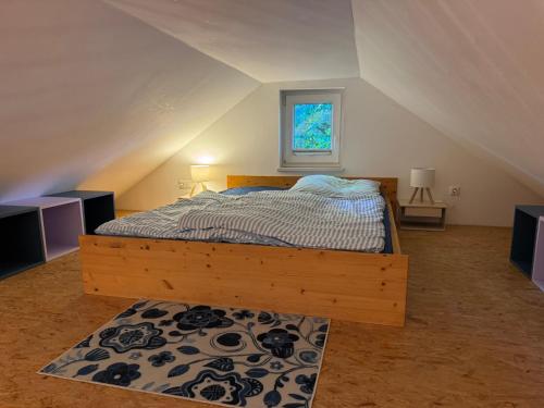a bedroom with a bed in an attic at Ferienhaus Loubier Marne in Marne