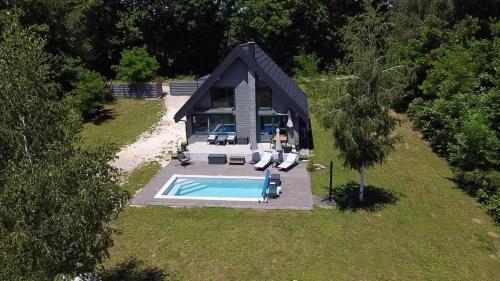 an overhead view of a house with a swimming pool at River House Moon in Gospić
