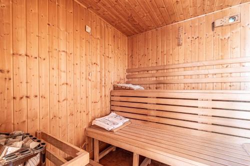 a wooden sauna with a wooden bench in it at Pool Chalet Adonis w/ Panoramic Views - Happy Rentals in Semič