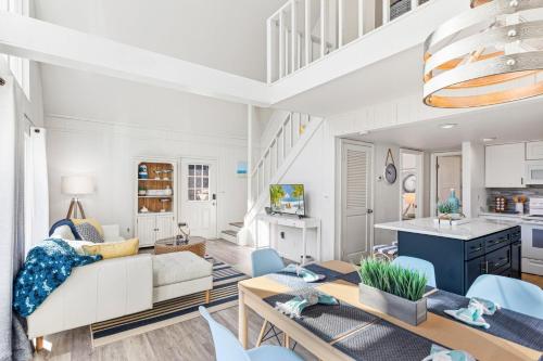 a living room with a couch and a table at 4068 - Family Tradition in Kitty Hawk