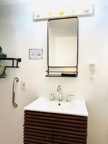 a bathroom with a sink and a mirror at Catskills The Bohemian Dream in Shandaken