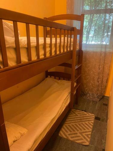 a couple of bunk beds in a room with a window at Good Dreams in Kyiv