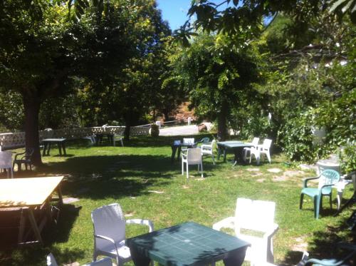 a group of chairs and tables in a park at Camping El Balcon de Pitres in Pitres