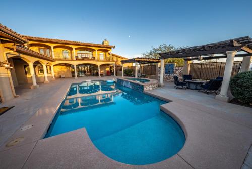 a swimming pool in front of a house at Sorelle Vineyard in Cornville