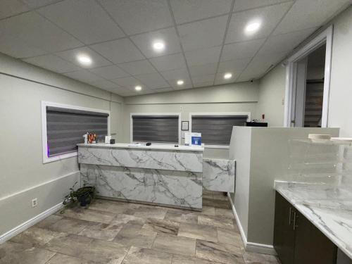 an office with a marble counter top in a room at Falls Lodge by the Falls (Formerly Knights Inn) in Niagara Falls