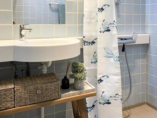 a bathroom with a sink and a mirror at 4 person holiday home in Aabenraa in Aabenraa