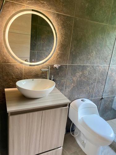 a bathroom with a sink and a mirror at Finca Samana in Tocaima