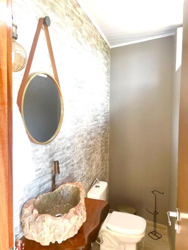 a bathroom with a sink and a toilet at Casa Bela Vista in Piranhas