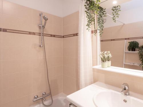 a bathroom with a shower and a sink at Nieuwendamme 40C in Lombardsijde