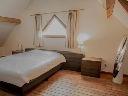 a bedroom with a large bed and a window at Le Lac Bleu nr 33 in Lacapelle-Marival