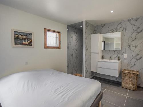 a bedroom with a white bed and a sink at Lac Bleu nr 19 in Lacapelle-Marival