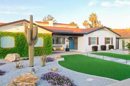 a house with a cactus in the front yard at Citrus Grove in Mesa
