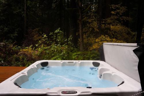 a white bath tub sitting on a table at On Mountain Time in Glacier