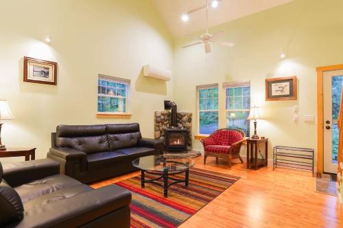 a living room with a couch and a coffee table at Glacier Pines in Glacier