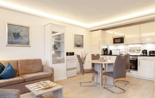 a living room with a couch and a table at Princess in Binz