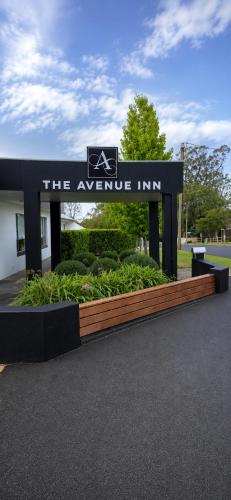 a sign for the avenue inn in a park at The Avenue Inn in Naracoorte