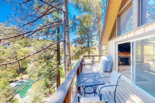 a porch of a house with a table and chairs at Rocky Pines in Twin Peaks