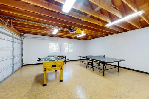 a room with two ping pong tables in it at Rocky Pines in Twin Peaks
