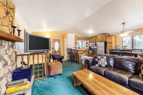 a living room with a couch and a tv at Morrison Manor in Lake Arrowhead