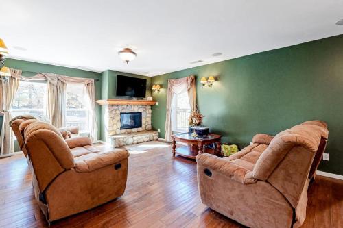 a living room with two couches and a fireplace at Running Springs R-n-R in Running Springs