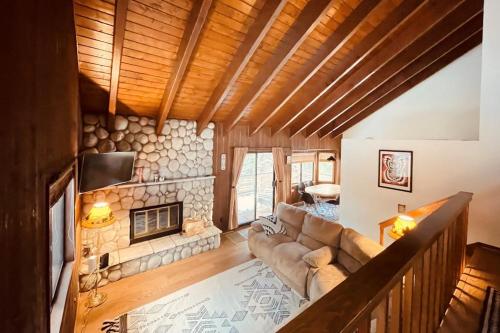 a living room with a couch and a fireplace at Grey Stone Fire in Running Springs