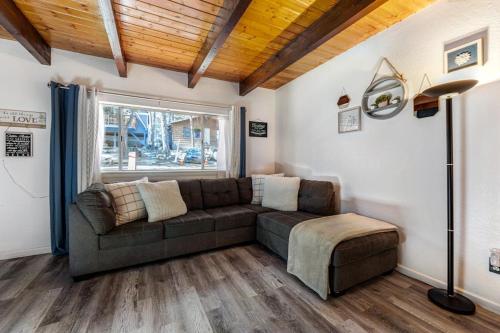 a living room with a couch and a window at Blue Bird Beauty in Running Springs