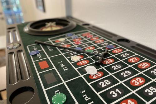 a close up of a remote control with a game at Red Cottage Charmer in Lake Arrowhead