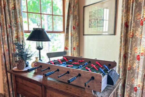a wooden box filled with wine bottles in a room at Treetop Cottage in Running Springs