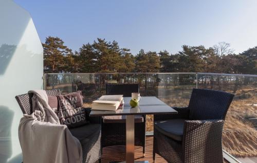a patio with a table and chairs on a balcony at Princess in Binz