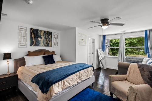 a bedroom with a bed and a ceiling fan at Waterfront Gem in Willingboro