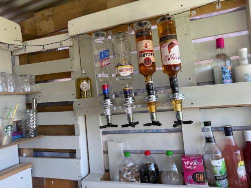 a shelf with bottles of alcohol on it at Greek sensation in Zagora
