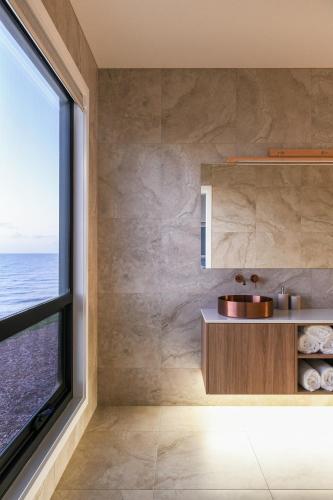 a bathroom with a sink and a window at The Cove Tasmania in Devonport