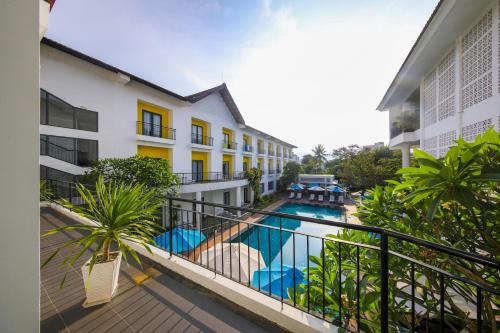 a balcony view of a hotel with a swimming pool at ÊMM Hotel Hoi An in Hoi An