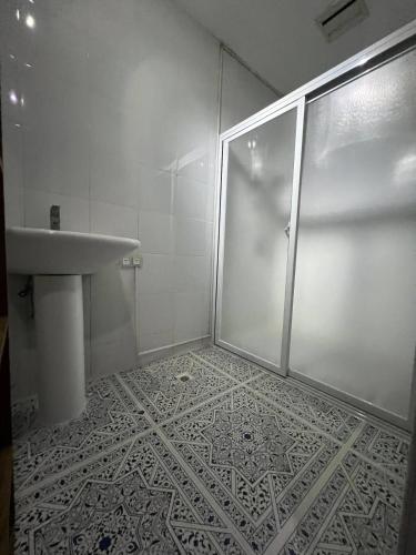 a bathroom with a shower and a sink at Rosa Executive Residence in heart of Ormoc City in Ormoc