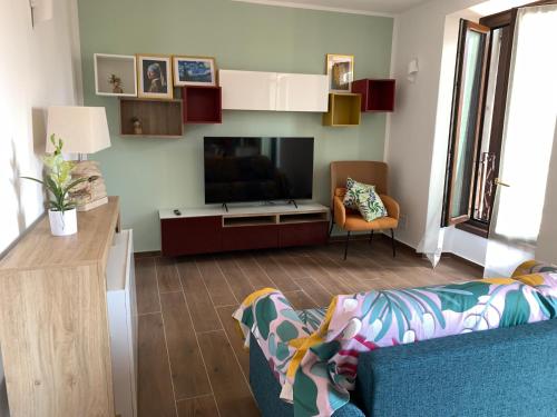 a living room with a large flat screen tv at Casa vacanza Gea - Superior Apartment in Bergamo city with private parking car in Bergamo