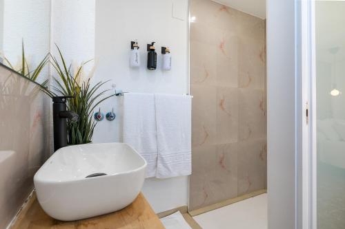 a bathroom with a white sink and a shower at Studio with Terrace & Stunning Views in Güéjar-Sierra