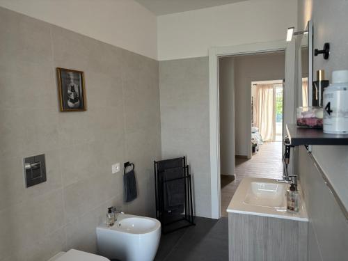 a bathroom with a toilet and a sink at Serendipity in Elmas