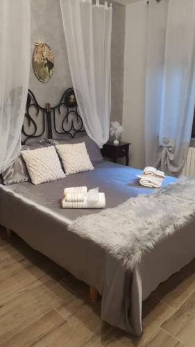 a bedroom with a bed with two towels on it at La Suite nella Valle in Trecchina