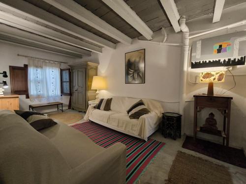 a living room with a couch and a fireplace at Casa en urb Cala Montgó in L'Escala