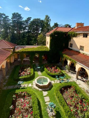 an aerial view of a house with a garden at Sigtunastiftelsen Hotell & Konferens in Sigtuna