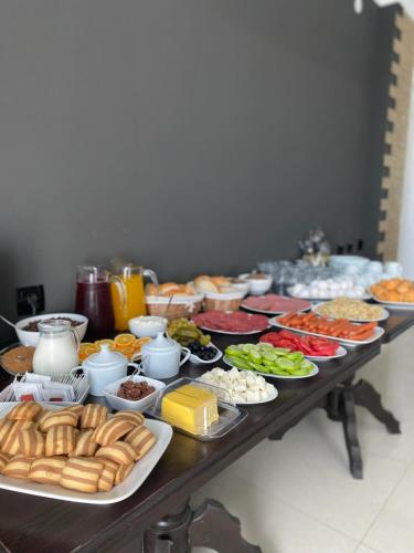 a table with many plates of food on it at Telavi ERMA in Telavi