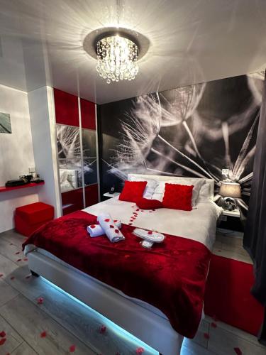 a bedroom with a bed with two stuffed animals on it at "glamappartspa" design experience & Parking in Dijon