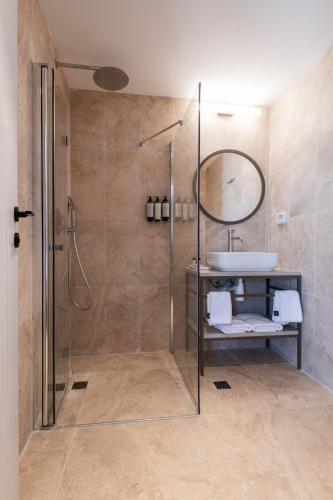 a bathroom with a shower and a sink at Hotel Beit Shmuel in Jerusalem