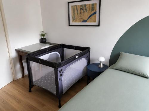 a room with a bed and a tv in it at Le Nid Didier in Saint-Didier-en-Velay